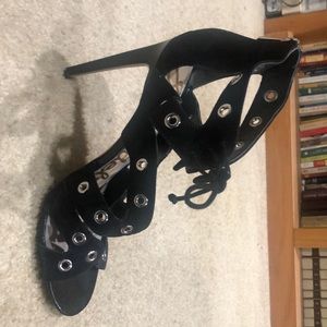 Black, open toe, high heel with tie at ankle.